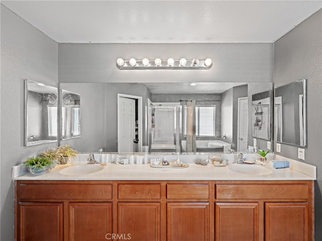 bathroom with independent shower and bath and vanity