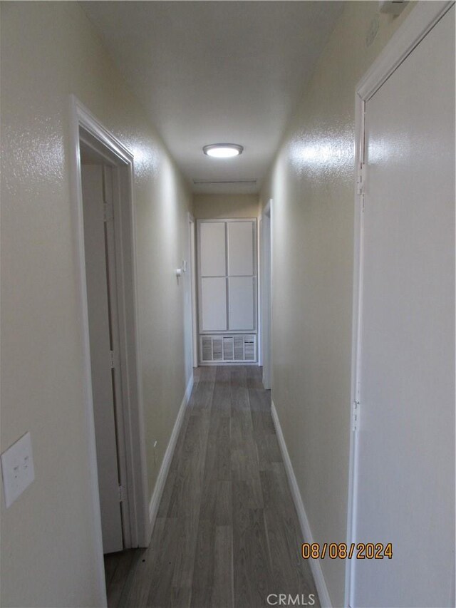 hall featuring dark wood-type flooring