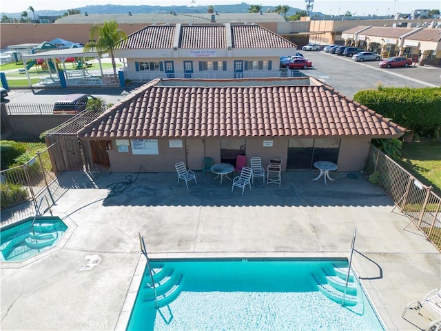 view of swimming pool with a patio area