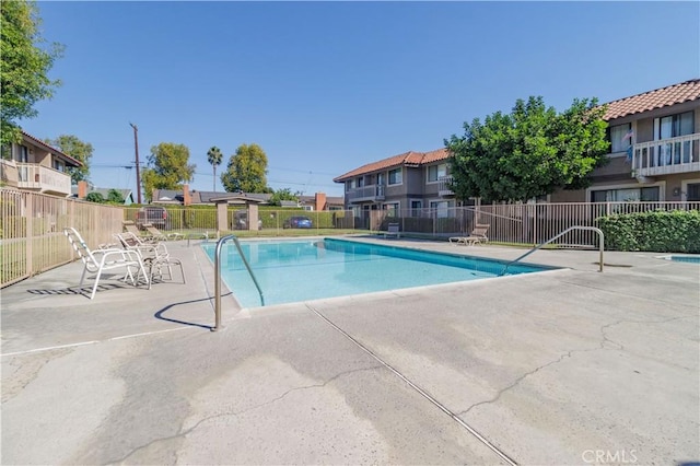 view of pool featuring a patio