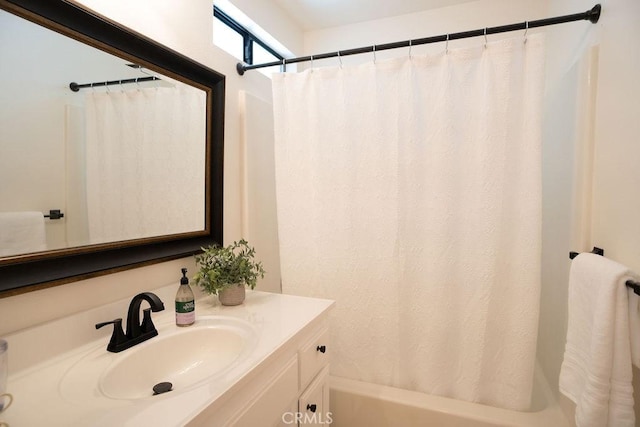 bathroom with vanity and shower / bath combo with shower curtain