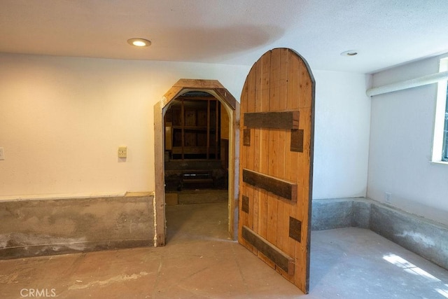 hallway with concrete flooring