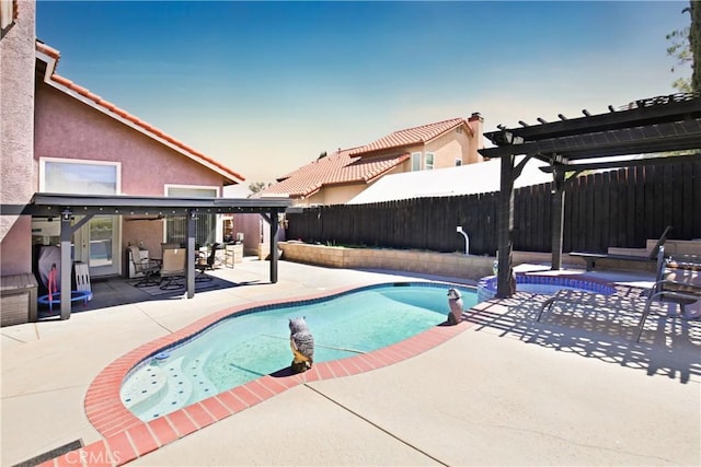 pool at dusk with a patio and a pergola