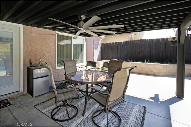 view of patio featuring ceiling fan