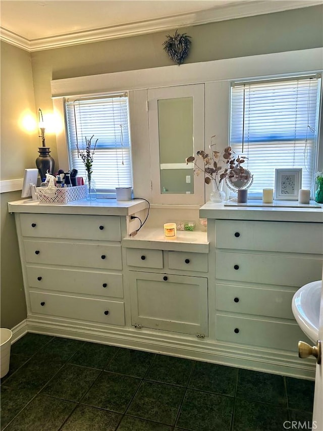 bathroom with tile patterned floors and crown molding