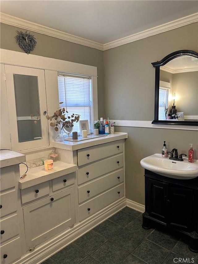 bathroom featuring tile patterned flooring, vanity, and ornamental molding