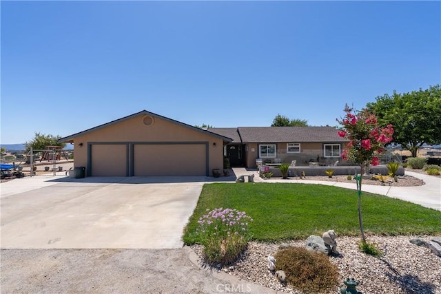 ranch-style house with a garage and a front lawn