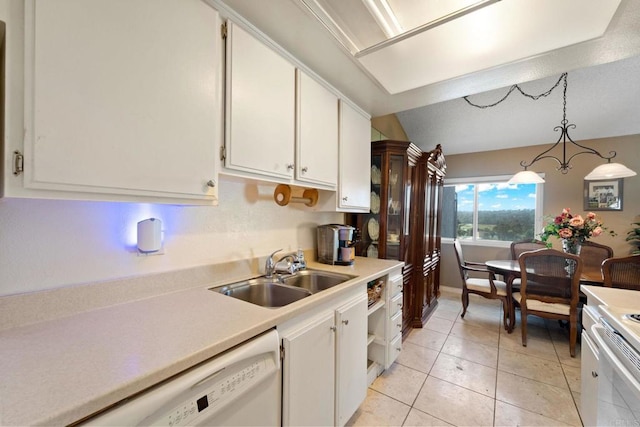 kitchen with pendant lighting, sink, white appliances, and white cabinetry