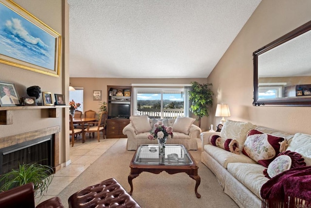 tiled living room featuring a textured ceiling and vaulted ceiling