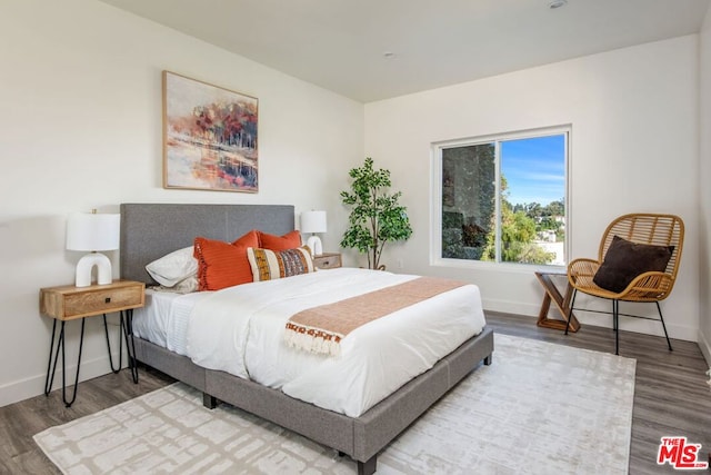 bedroom featuring wood-type flooring