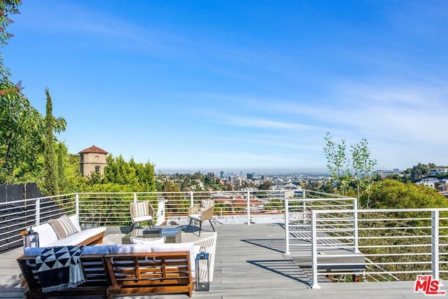 wooden terrace featuring an outdoor hangout area