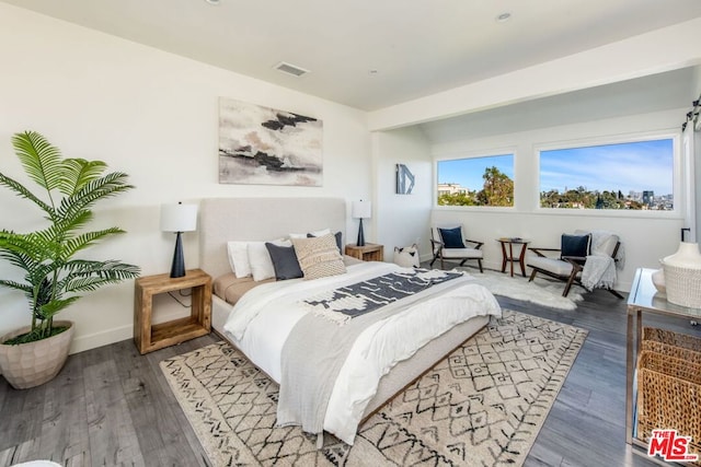 bedroom featuring wood-type flooring