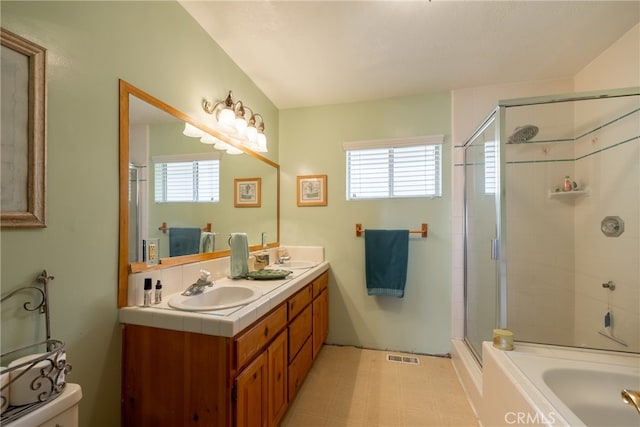 bathroom featuring vanity, shower with separate bathtub, and plenty of natural light