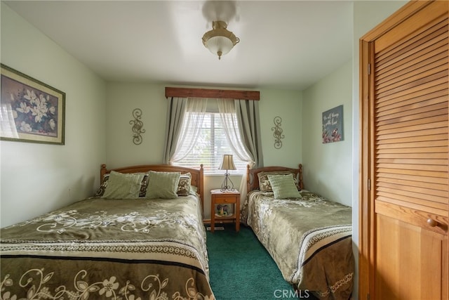 bedroom featuring dark colored carpet