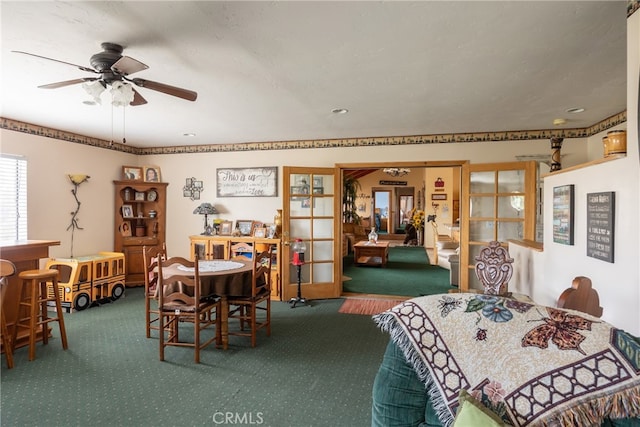 dining room featuring carpet and ceiling fan