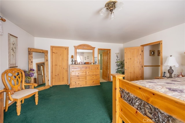 bedroom with dark colored carpet