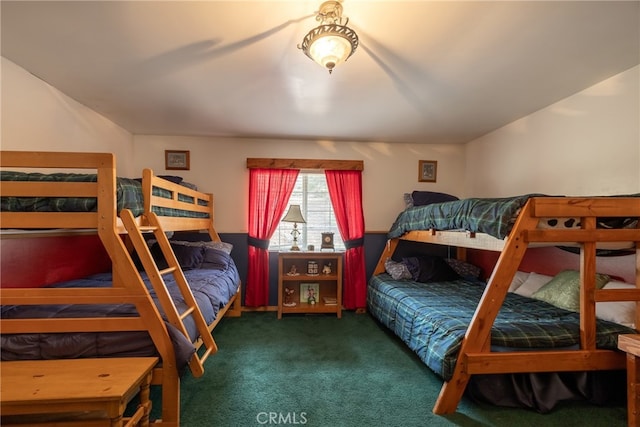 bedroom featuring dark colored carpet