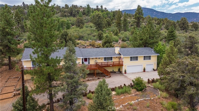 birds eye view of property featuring a mountain view