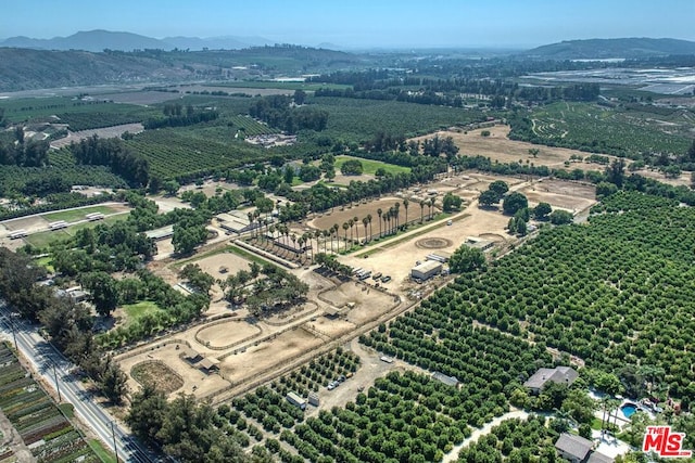 drone / aerial view featuring a mountain view and a rural view