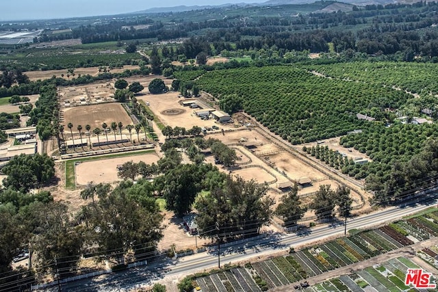 birds eye view of property with a rural view