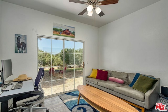 office featuring light wood-type flooring and ceiling fan