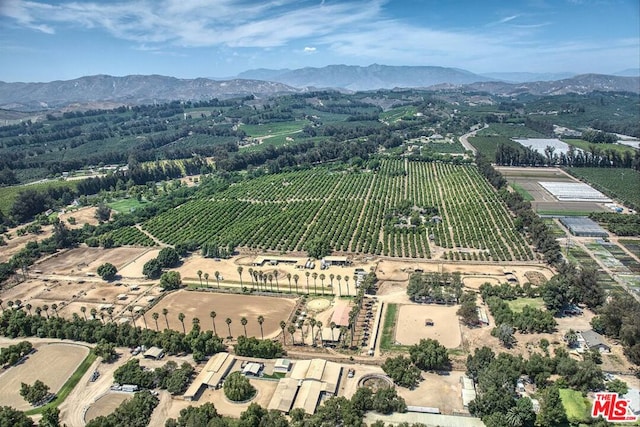 aerial view with a mountain view and a rural view