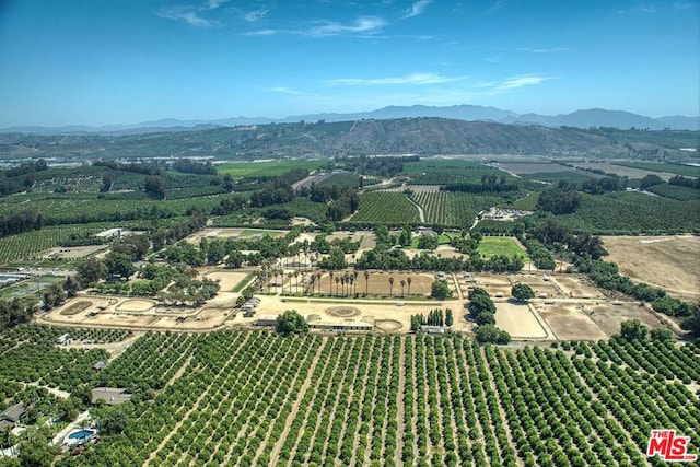 drone / aerial view with a mountain view and a rural view