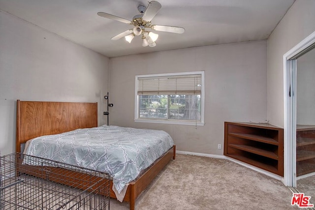 bedroom featuring light colored carpet and ceiling fan