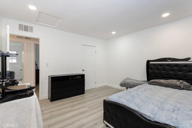 bedroom featuring light wood-type flooring