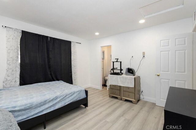 bedroom with light hardwood / wood-style flooring