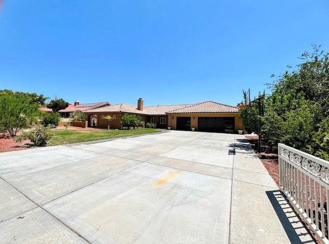 ranch-style house with a front yard and a garage