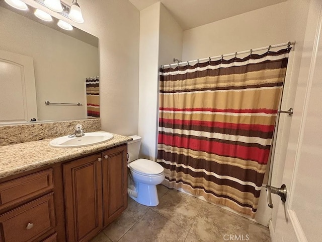 bathroom with tile patterned flooring, vanity, a shower with shower curtain, and toilet