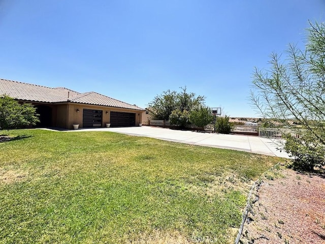 view of yard featuring a garage