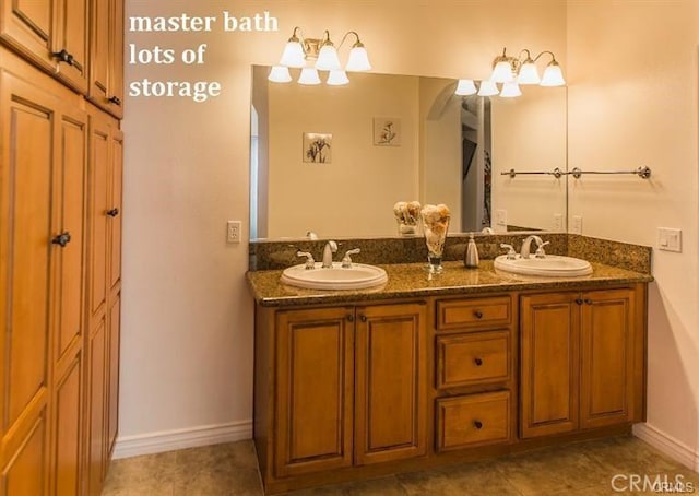 bathroom with tile patterned floors and vanity