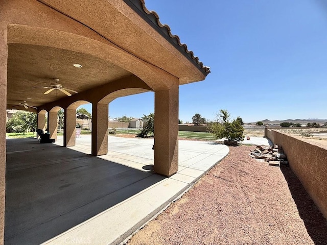 view of patio / terrace featuring ceiling fan