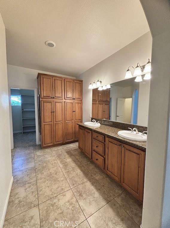 bathroom featuring tile patterned floors and vanity