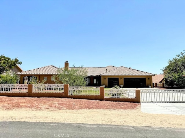 view of front of property with a garage