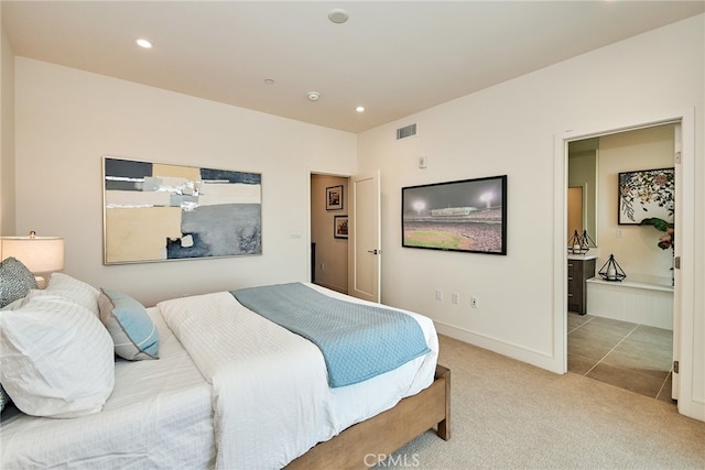 bedroom with light colored carpet