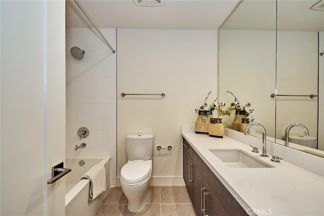 full bathroom featuring tile patterned flooring, tiled shower / bath combo, vanity, and toilet