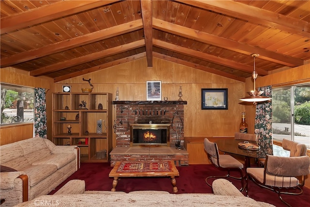 living room featuring wooden ceiling, a fireplace, wood walls, and lofted ceiling with beams