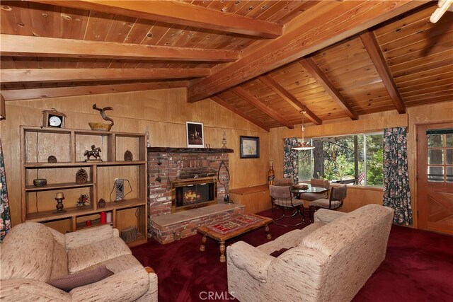 carpeted living room with wood ceiling, a brick fireplace, vaulted ceiling with beams, and wooden walls