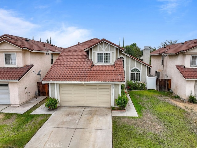 view of front of property featuring a front yard and a garage