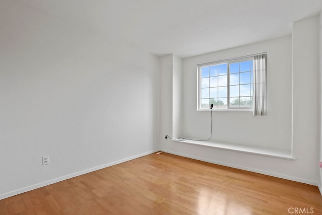 unfurnished room featuring light hardwood / wood-style floors