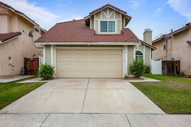 view of front of home featuring a garage and a front yard