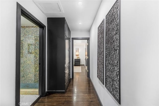 hallway with dark hardwood / wood-style floors