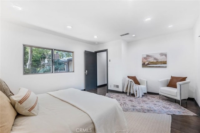 bedroom featuring dark hardwood / wood-style floors