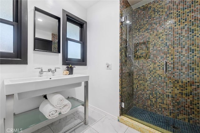 bathroom with a shower with door