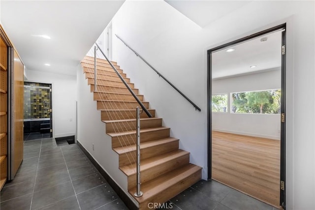 stairs with hardwood / wood-style flooring