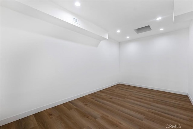 unfurnished room featuring dark hardwood / wood-style flooring