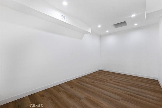 spare room featuring dark hardwood / wood-style floors